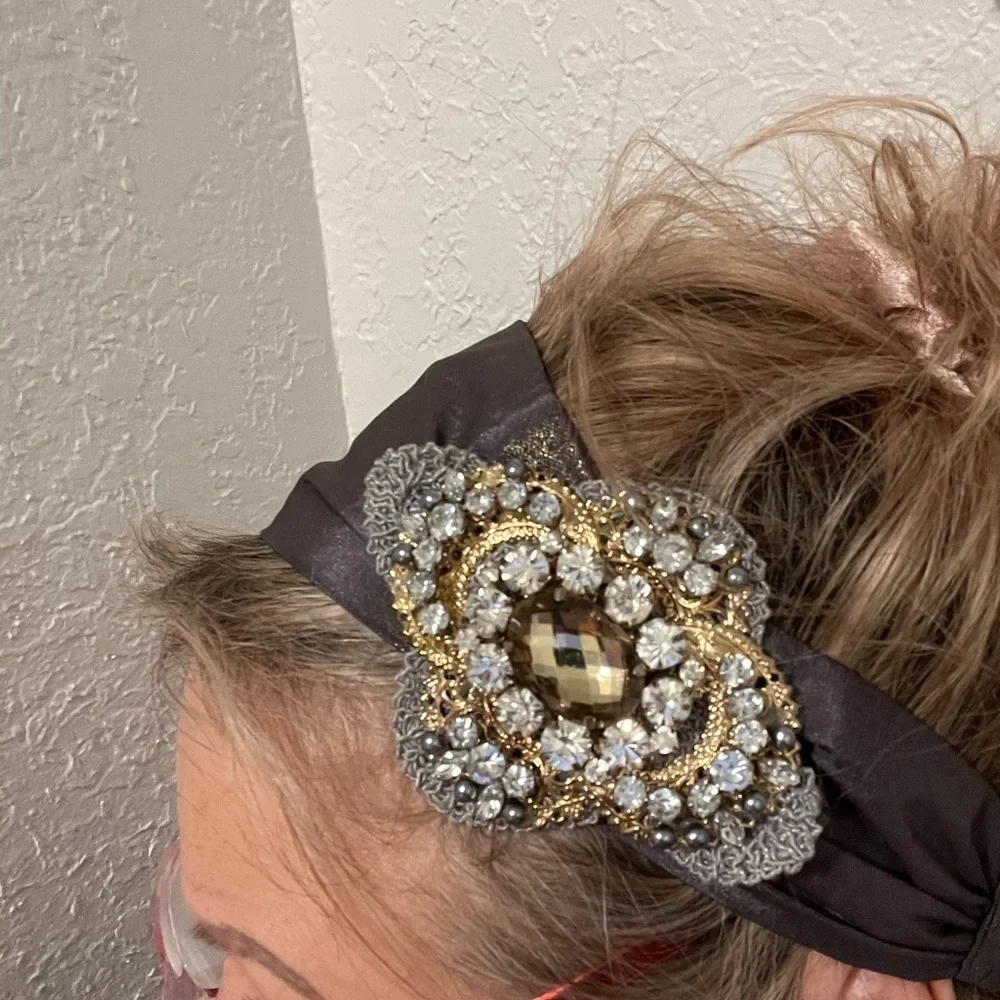 Headband, sparkling fabric and stunning brooch
